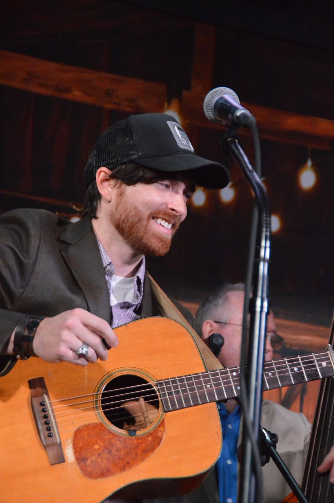 Justin Jones singing and playing guitar